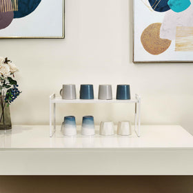 Nxconsu under-sink organizer helps maximize cabinet space.