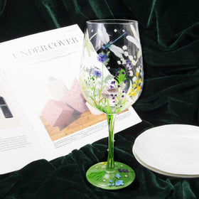 NymphFable hand-painted glass with floral accents enhances table decor