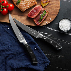 OAKSWARE 4-piece set shown with roast and steaks for versatile slicing.