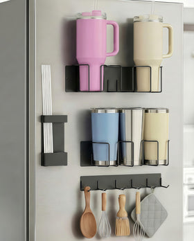 Oasis Origin magnetic cup holder on fridge with 4-piece set holding 20–40oz cups securely