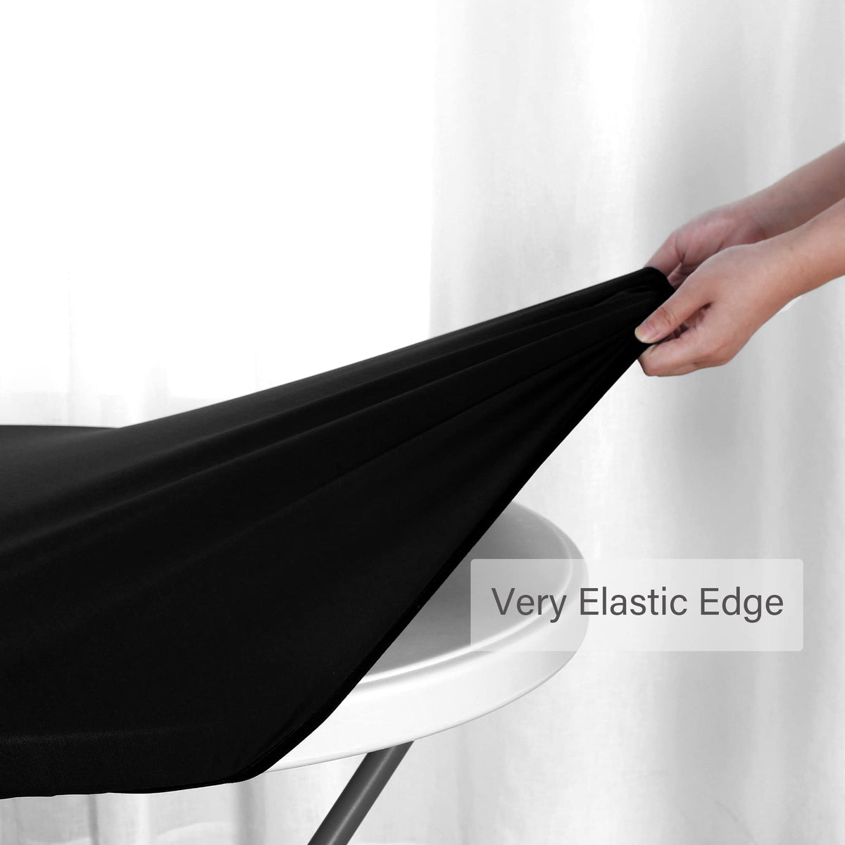 Obstal black round table cloth with a sleek finish for parties and daily use.