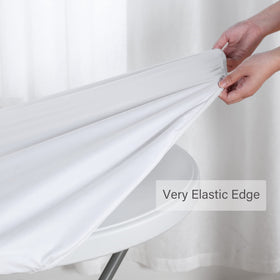 Obstal round table cloth in white adds a crisp, clean look.