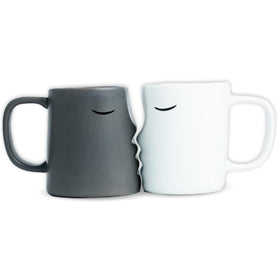 Occasionals kissing couple mug set front view for shared morning coffee rituals.