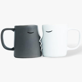 Occasionals kissing couple mug set gift-ready for anniversaries and Valentine's Day.
