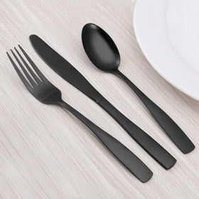 O.C.E. matte-black silverware set displayed on a stylish table setting