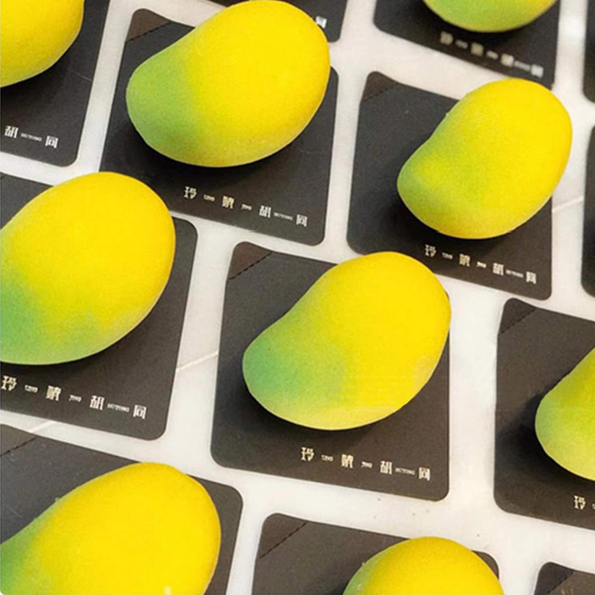 OCPO Kitchen mango silicone mold for cake decoration with vibrant 3D mango shapes.