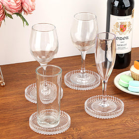 OGANAZI tempered-glass coaster with raised border detail for durability