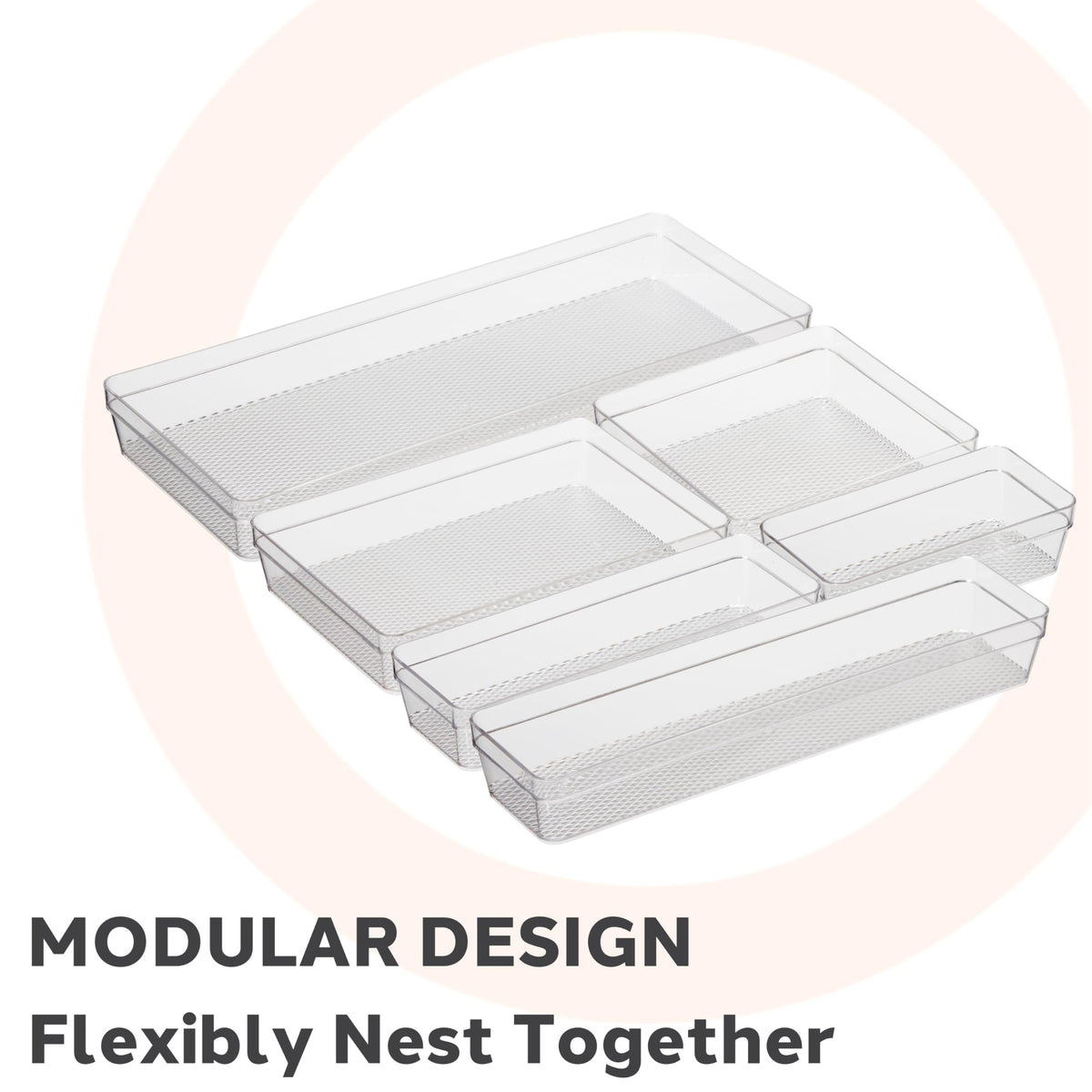 Oggi clear drawer organizer in kitchen drawer keeps utensils neatly separated.