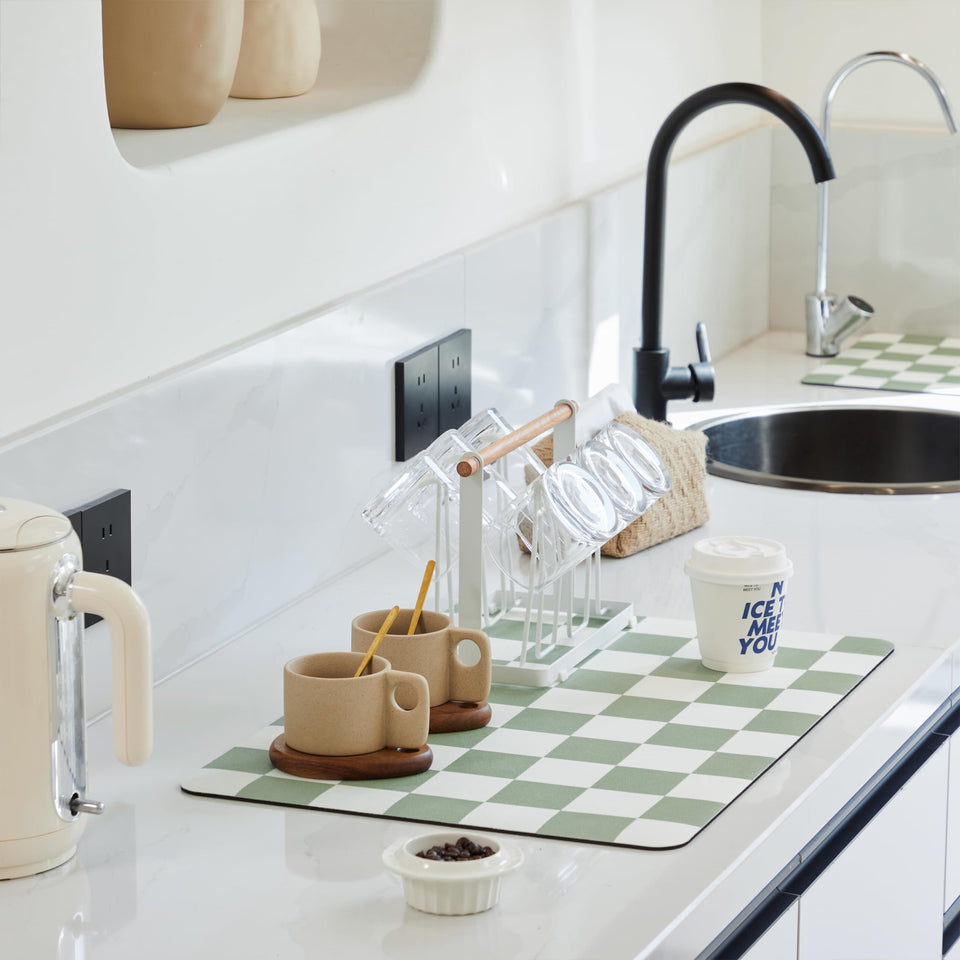 Ohocut Sage checkered drying mat on counter absorbs spills quickly.