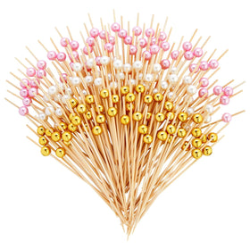 Okuna Outpost bamboo pearl toothpicks with white pink gold pearls for elegant appetizers.