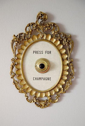 Okuorze champagne button frame in gold adds chic hotel vibes.