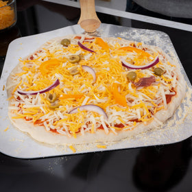 Old Stone pizza peel design features a long handle and sturdy aluminum for steady transfers