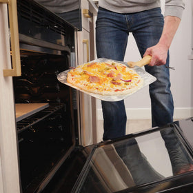 Old Stone pizza peel folds for compact storage after use