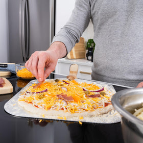 Old Stone pizza peel positions pizzas safely toward the back of the oven
