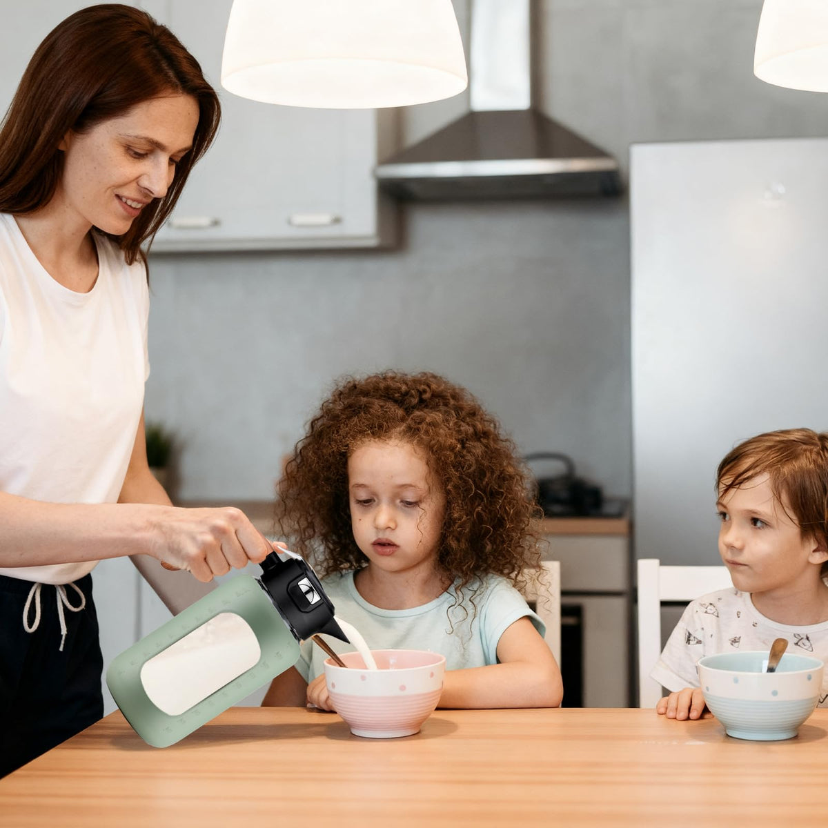 Elegant wooden handle provides a non-slip grip for pouring.