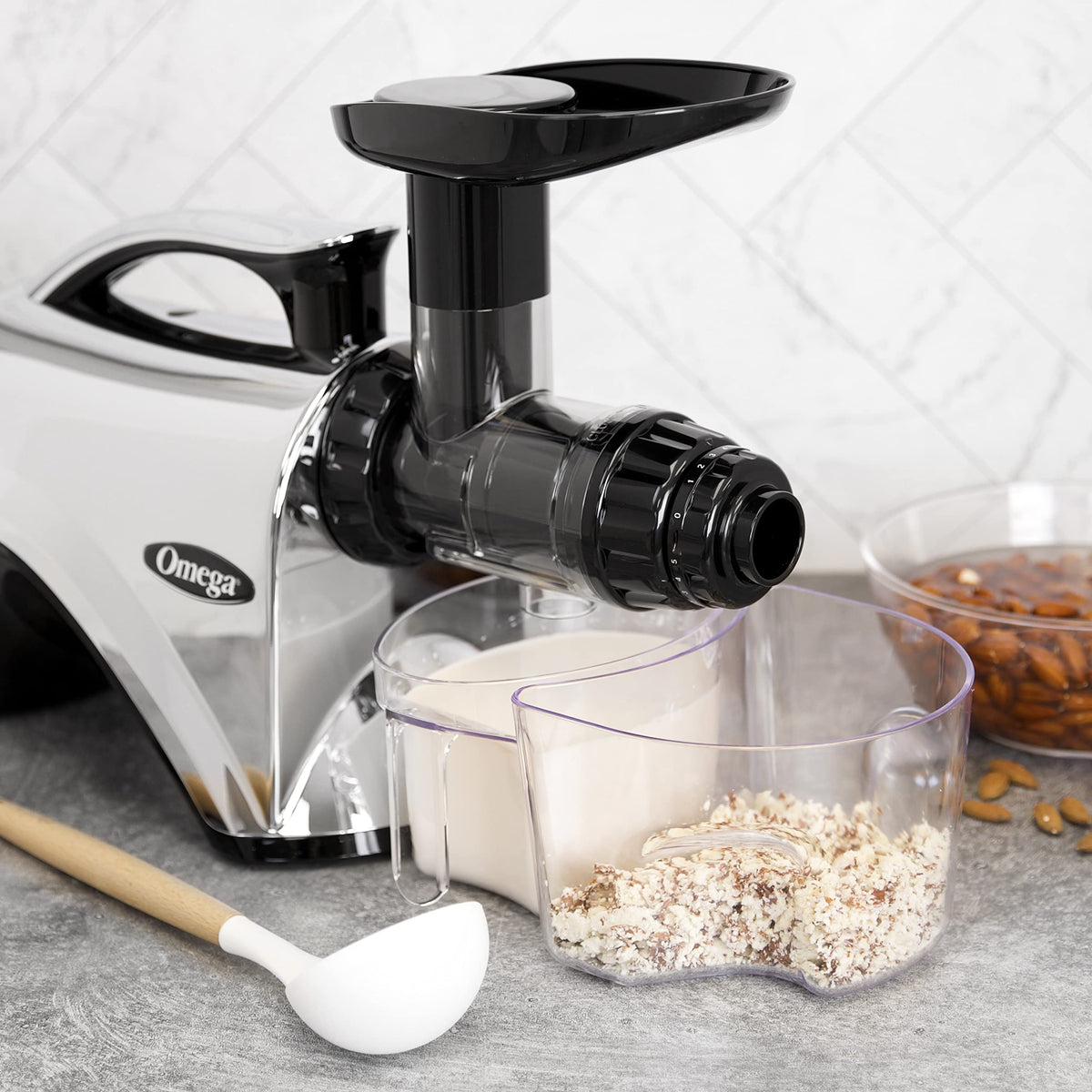 Omega NC900HD end-cap close-up highlighting adjustable pressure for maximum output.
