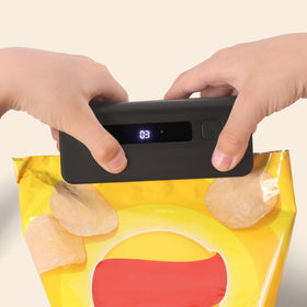 OMGOD in use sealing a chip bag for freshness