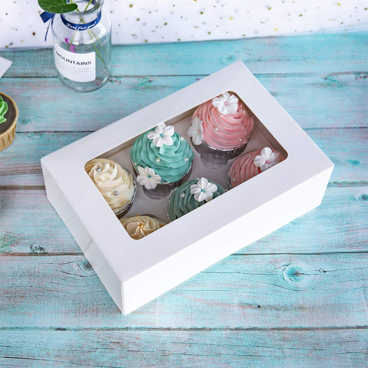 ONE MORE Cupcake Boxes white kraft board emphasizes durable, food-grade packaging.