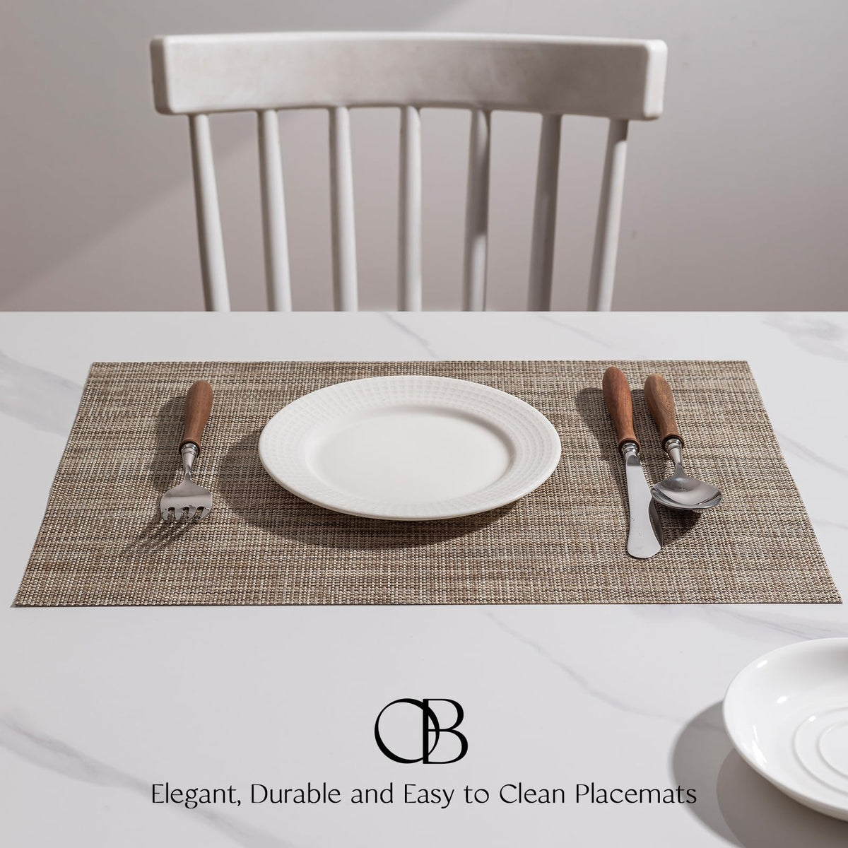 Onebento placemats in a durable PVC-polyester blend shown near dinnerware.