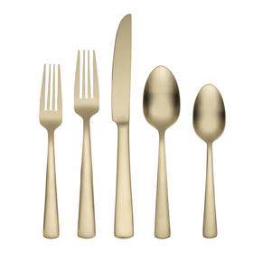 Oneida Aptitude Champagne Satin flatware laid out for a formal dinner.