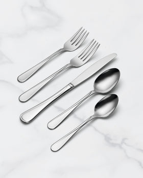 Hand holding Oneida Flight flatware illustrating comfortable grip and timeless style