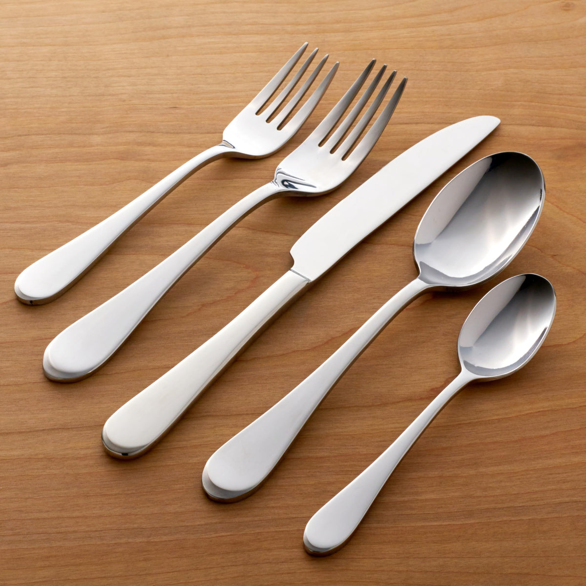 Oneida Icarus sugar spoon on a polished surface