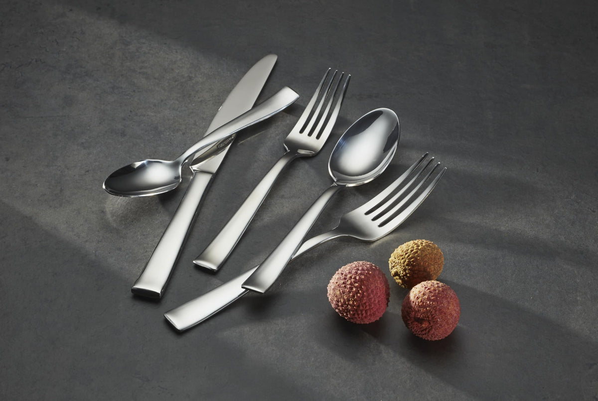 Oneida Monolith flatware setting for four, uniform and sleek.