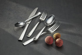 Oneida Monolith flatware setting for four, uniform and sleek.