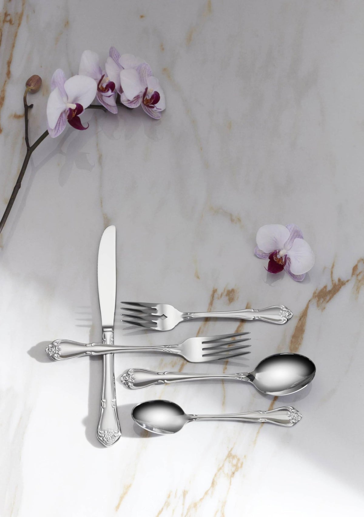 Oneida True Rose teaspoons shown in dishwasher-safe design for easy cleanup.