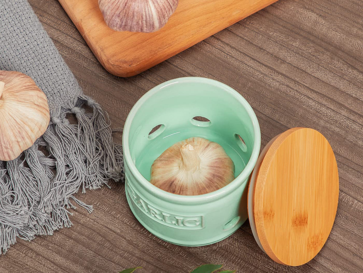 ONEMORE garlic keeper with glossy porcelain finish adds countertop charm.