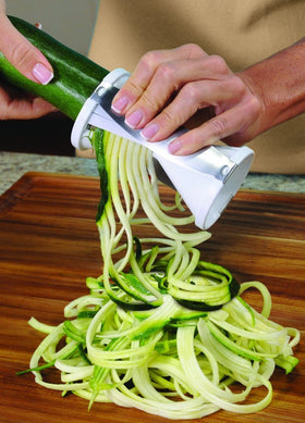 Ontel Veggetti spiked holder cap secures vegetable during cutting