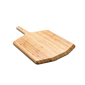 Ooni 12-inch bamboo pizza peel in use over oven for smooth transfer