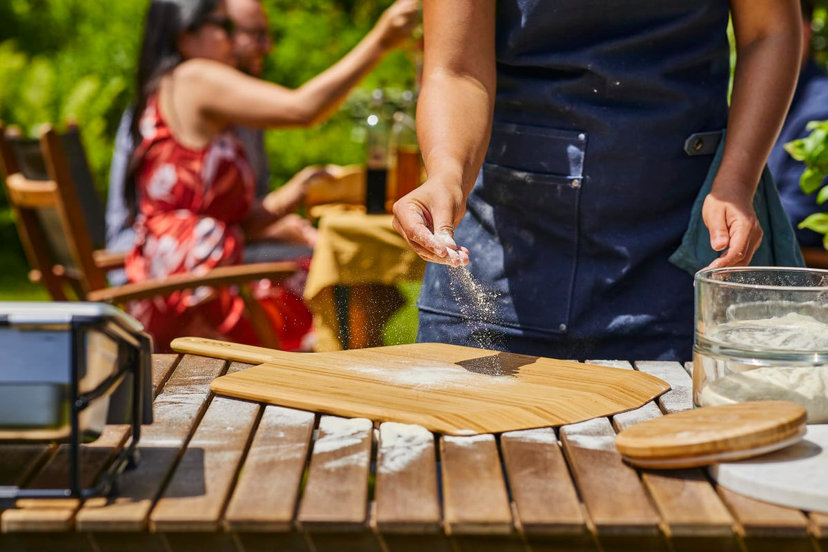 Ooni 16-inch paddle lightly dusted with flour for launch.