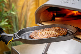 Ooni Grizzler Pan cast iron body provides steady heat and browning.