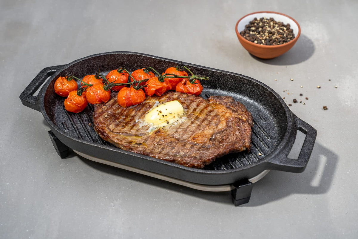 Ooni Grizzler Pan pre-seasoned cast iron ready for versatile cooking.