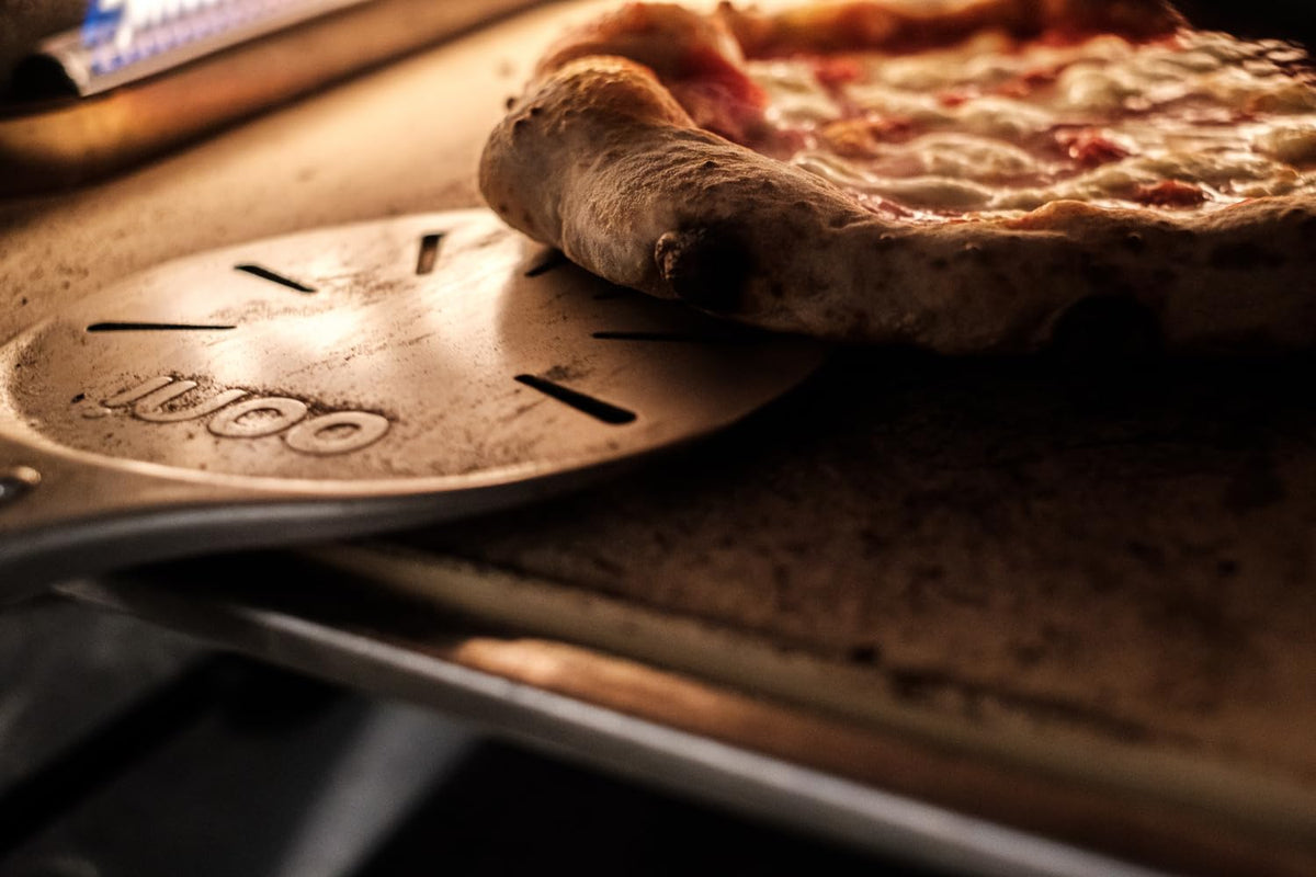 Ooni pizza turning peel with long handle for safer, comfortable use.