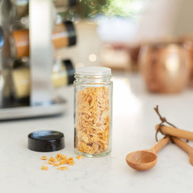 Orii compact kitchen organizer keeps spices neatly arranged on the counter.