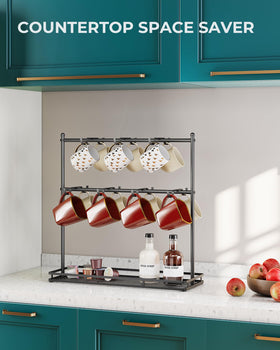 OROPY bottom-shelf mug stand stores pods and tea within easy reach