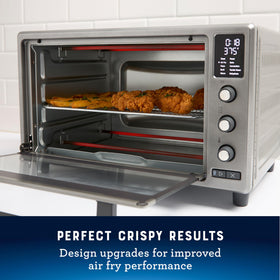 Oster 10 Function Air Fryer Oven interior view highlights roomy 26 qt space for larger dishes.