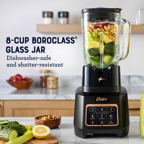 Oster Extreme Mix Blender shows the 1600W motor powering smooth blends and ice crushing.