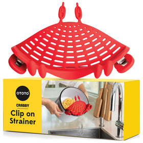 OTOTO Crabby clip-on strainer attached to pot for easy, safe draining.