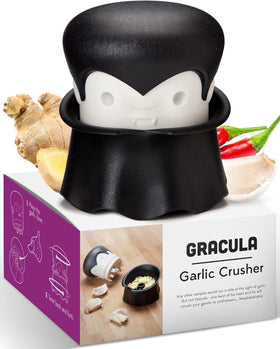 OTOTO Gracula garlic crusher in action mincing garlic cloves quickly for easy weeknight meals