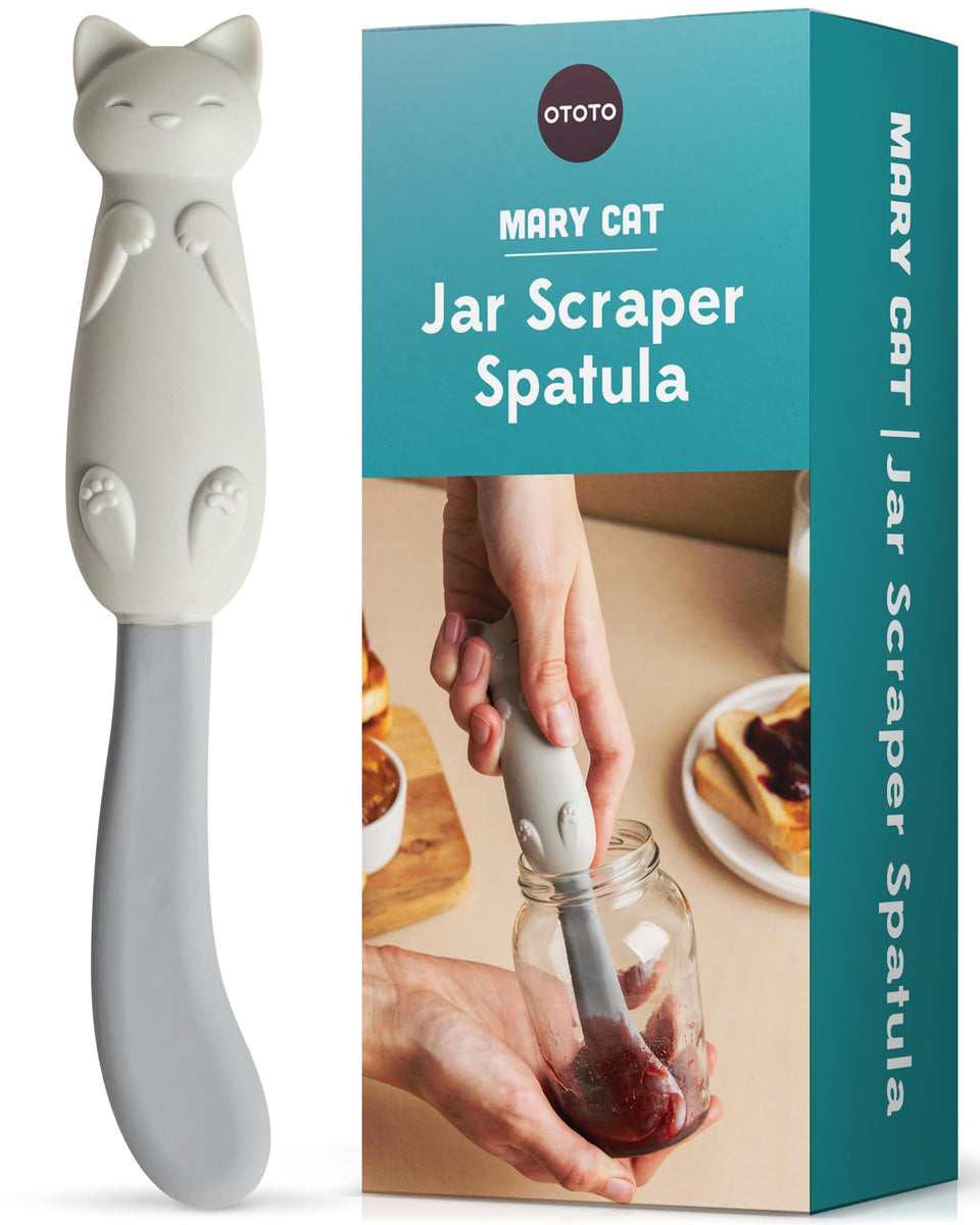 OTOTO Mary Cat jar scraper in action reaching the bottom for thorough scooping.