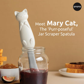 OTOTO Mary Cat silicone-tail scraper demonstrates flexible reach for easy gathering.