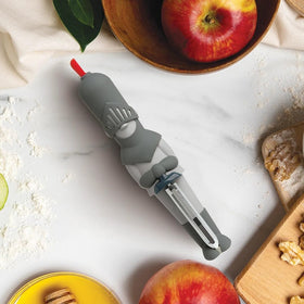 OTOTO Sir Peels A-Lot swivel blade in action for precise fruit and veg peeling.