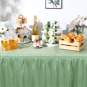 Oudain sage-green tablecloth and skirt setup at a reception.