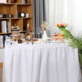 Oudain white table setup for weddings and celebrations with spill-friendly disposable decor