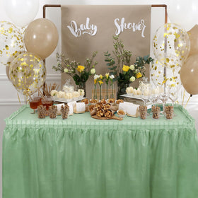 Oudain wedding reception with sage-green table decor.