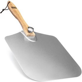 OUII pizza peel in use, delivering smooth transfers from oven to board