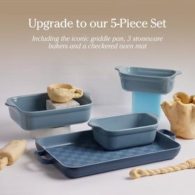 Our Place Griddle Pan with ergonomic handles for safe oven-mitt use.
